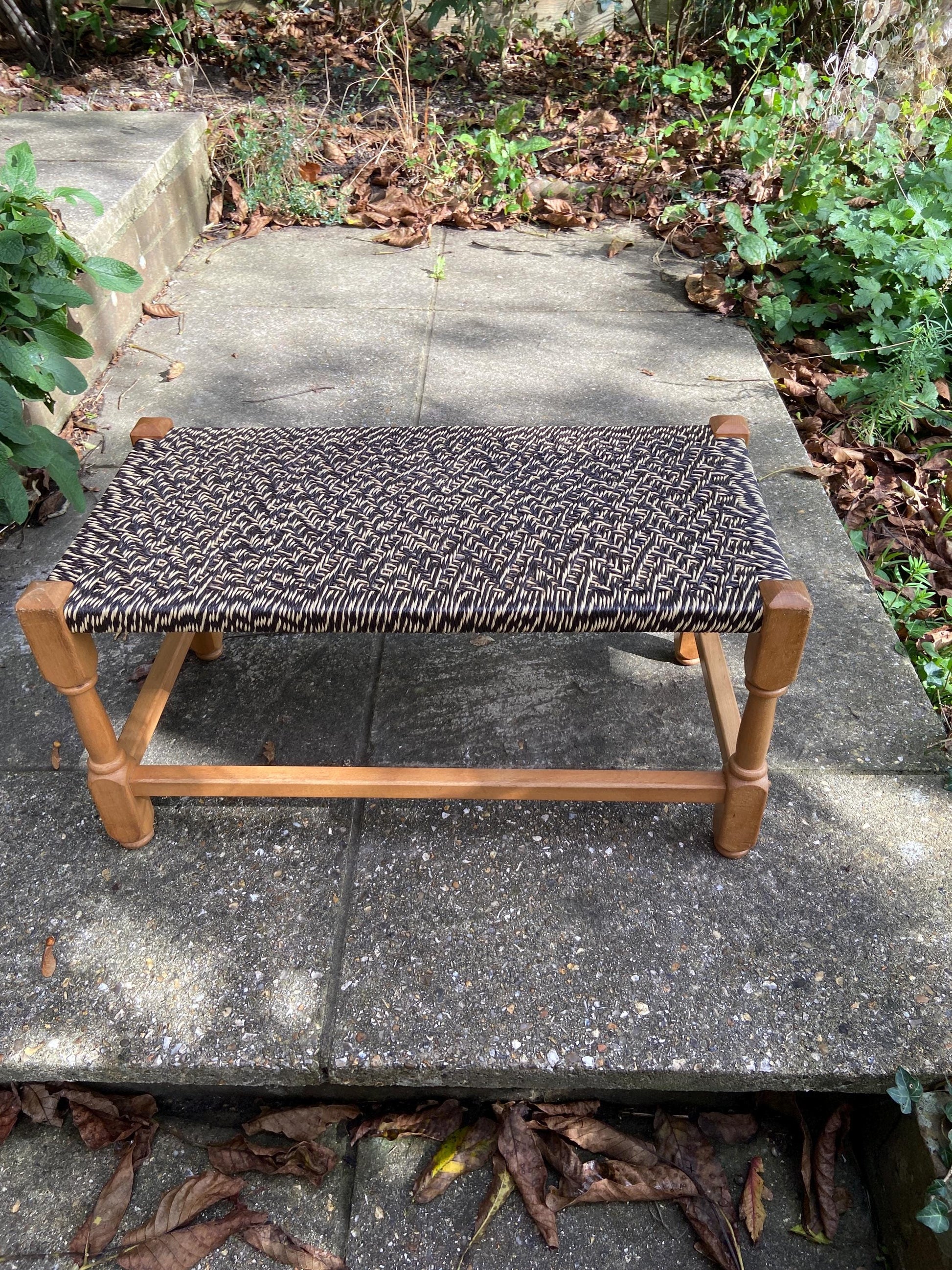 Retro strung string stool – excellent condition, black and white plastic string criss-cross on light coloured wooden frame