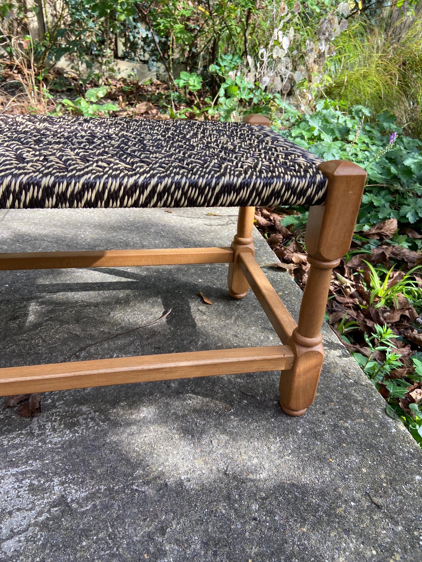 Retro strung string stool – excellent condition, black and white plastic string criss-cross on light coloured wooden frame
