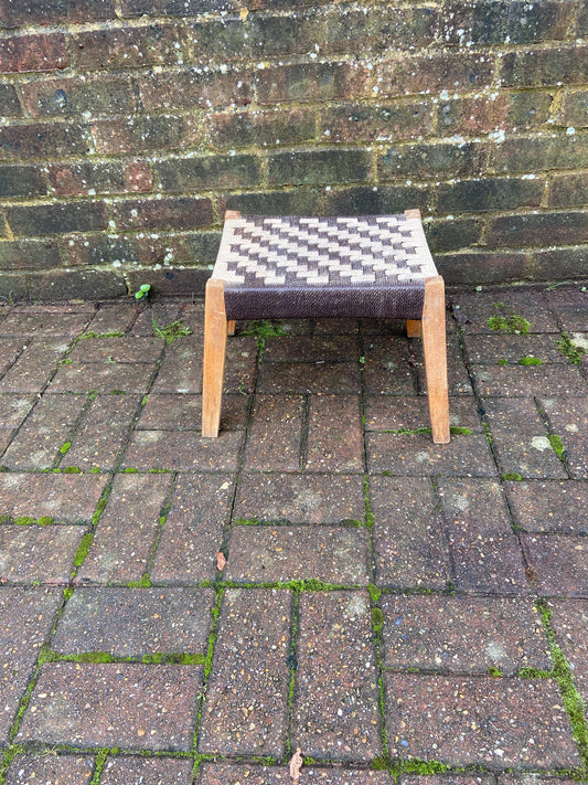 strong retro wooden stool with a strung seat. solid. slightly a frame legs. brown beige top.