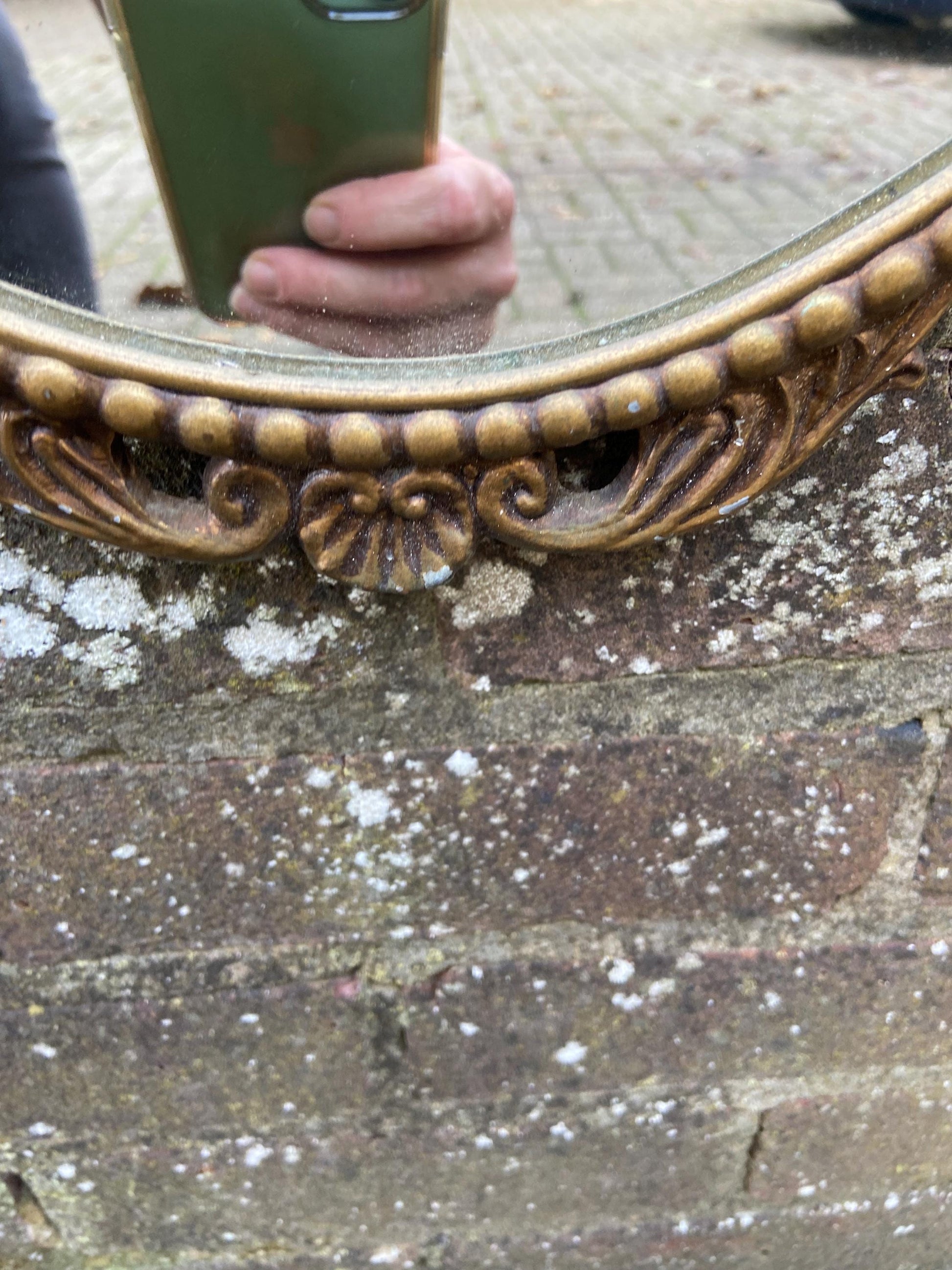 Delightful ornate vintage gilt metal framed oval mirror