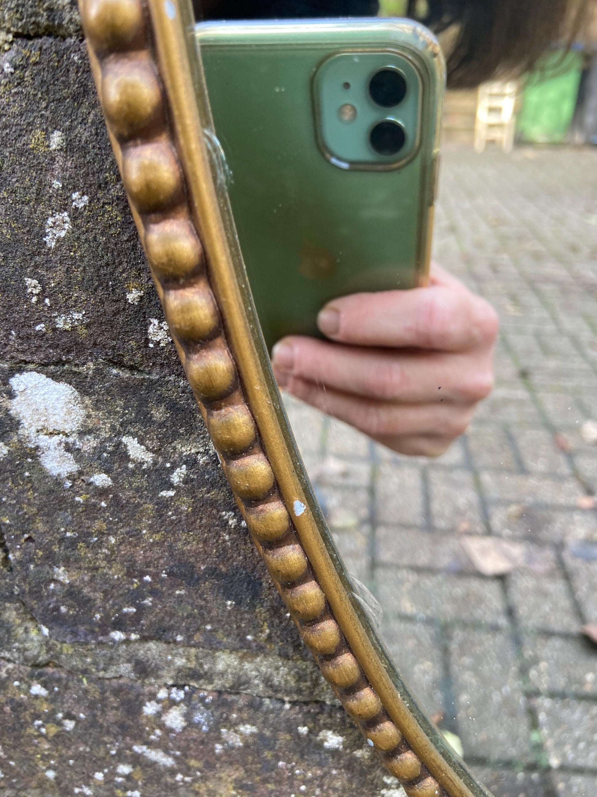 Delightful ornate vintage gilt metal framed oval mirror