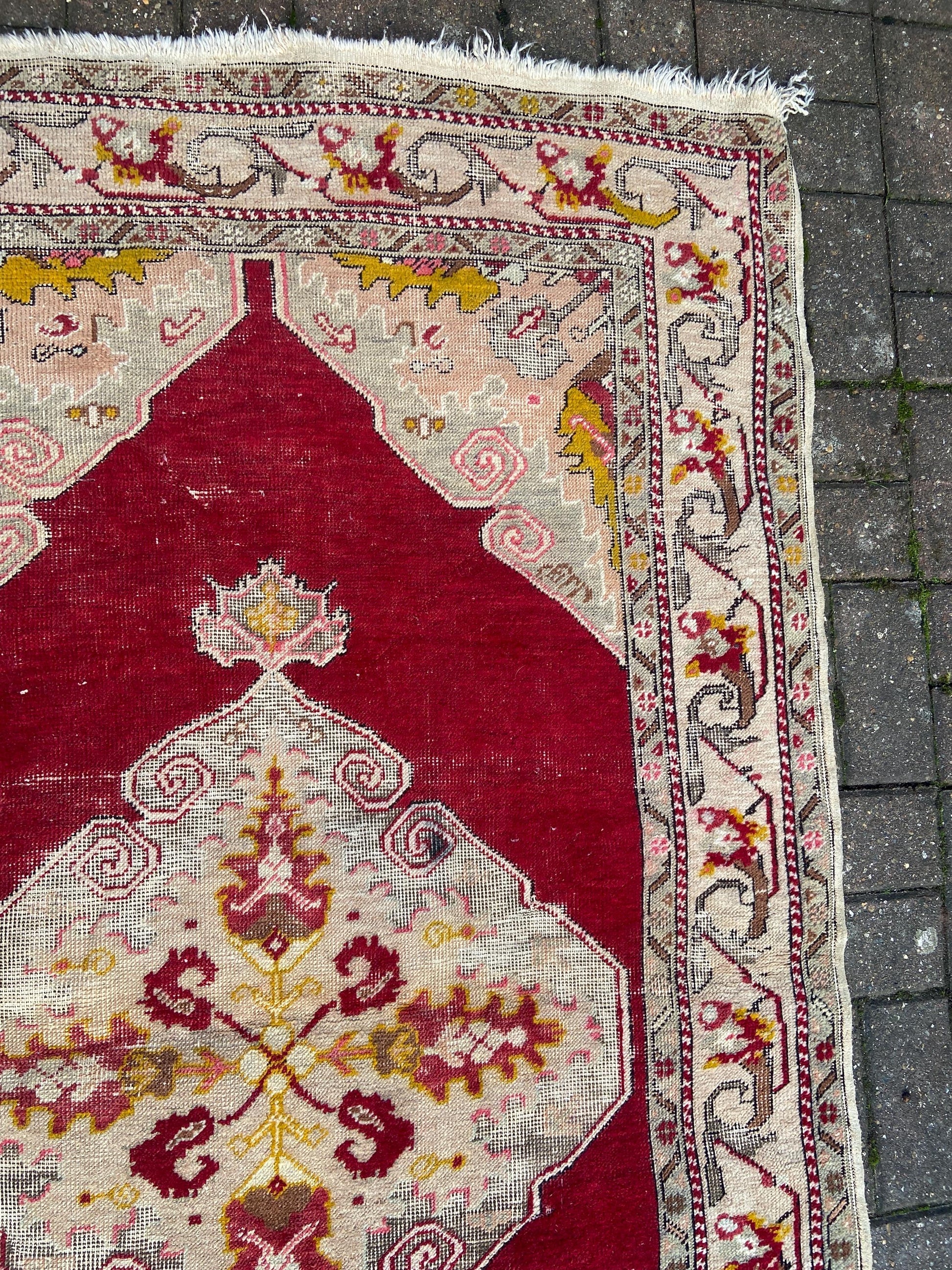 Vintage woollen rug, aged and charming, pinks reds golds (170cm x 106cm)