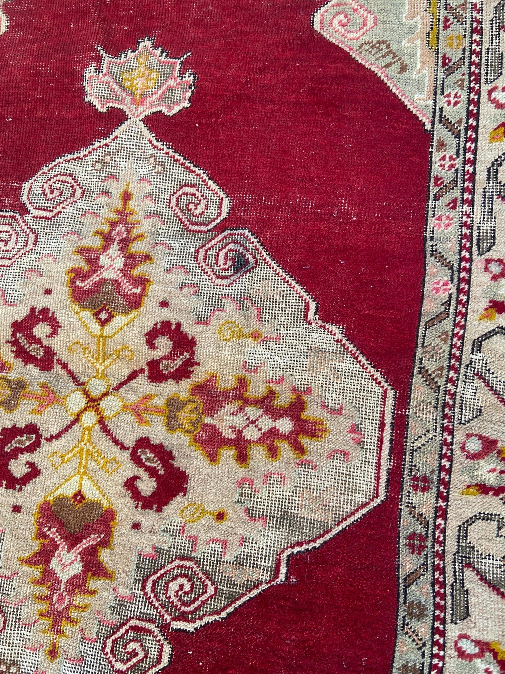 Vintage woollen rug, aged and charming, pinks reds golds (170cm x 106cm)