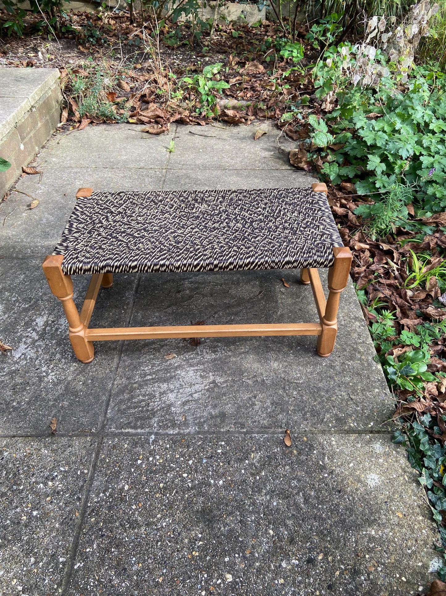 wide retro string stool. woven string stool. retro stool. black and white stool. wooden stool. footstool. foot stool.