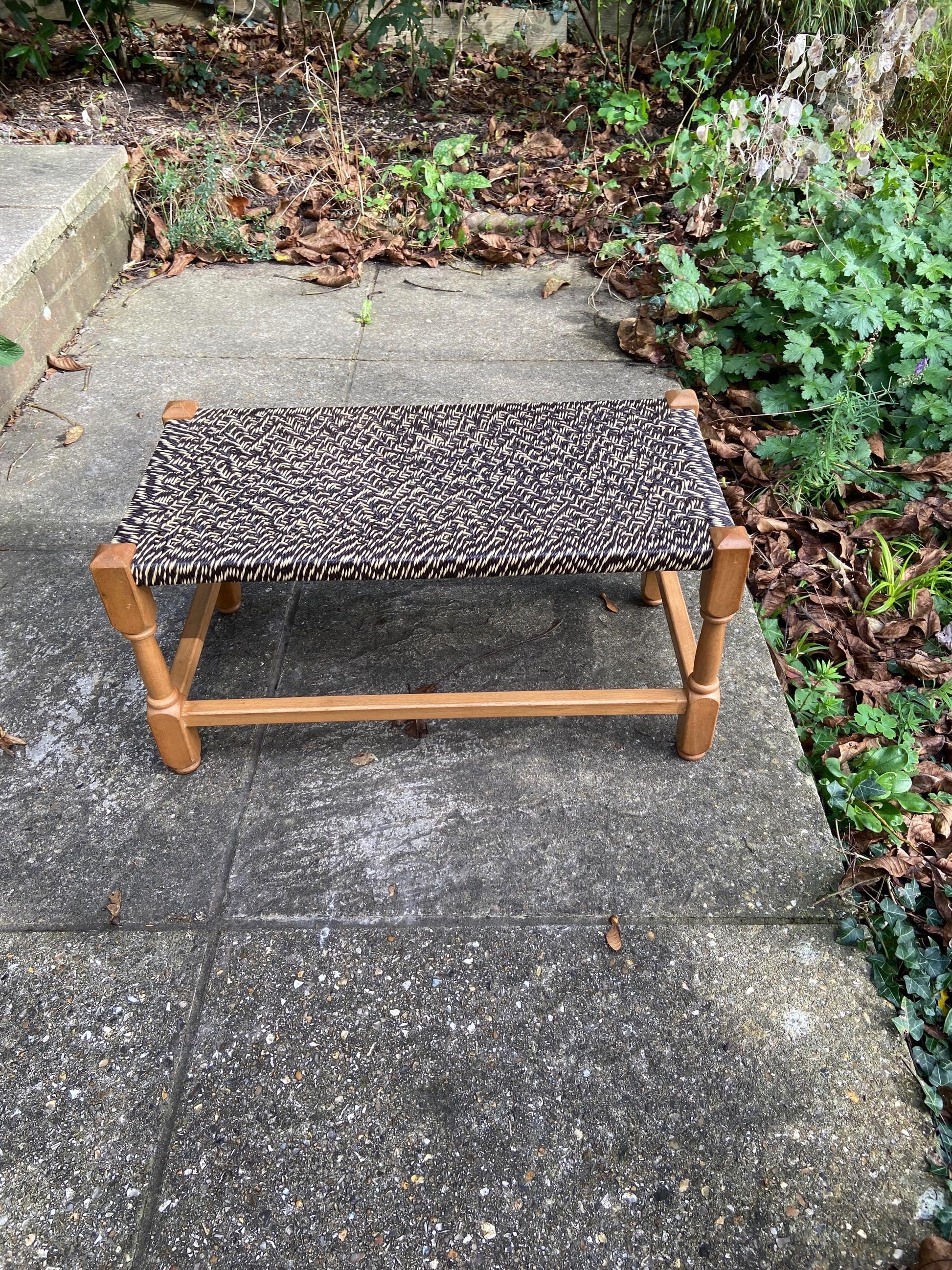 wide retro string stool. woven string stool. retro stool. black and white stool. wooden stool. footstool. foot stool.