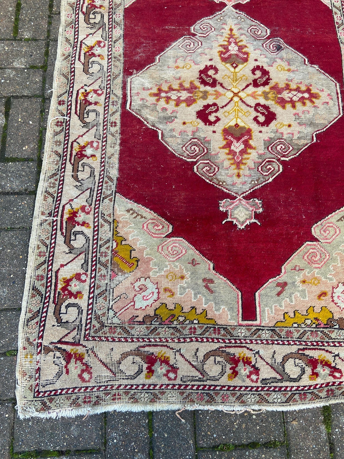Vintage woollen rug, aged and charming, pinks reds golds (170cm x 106cm)