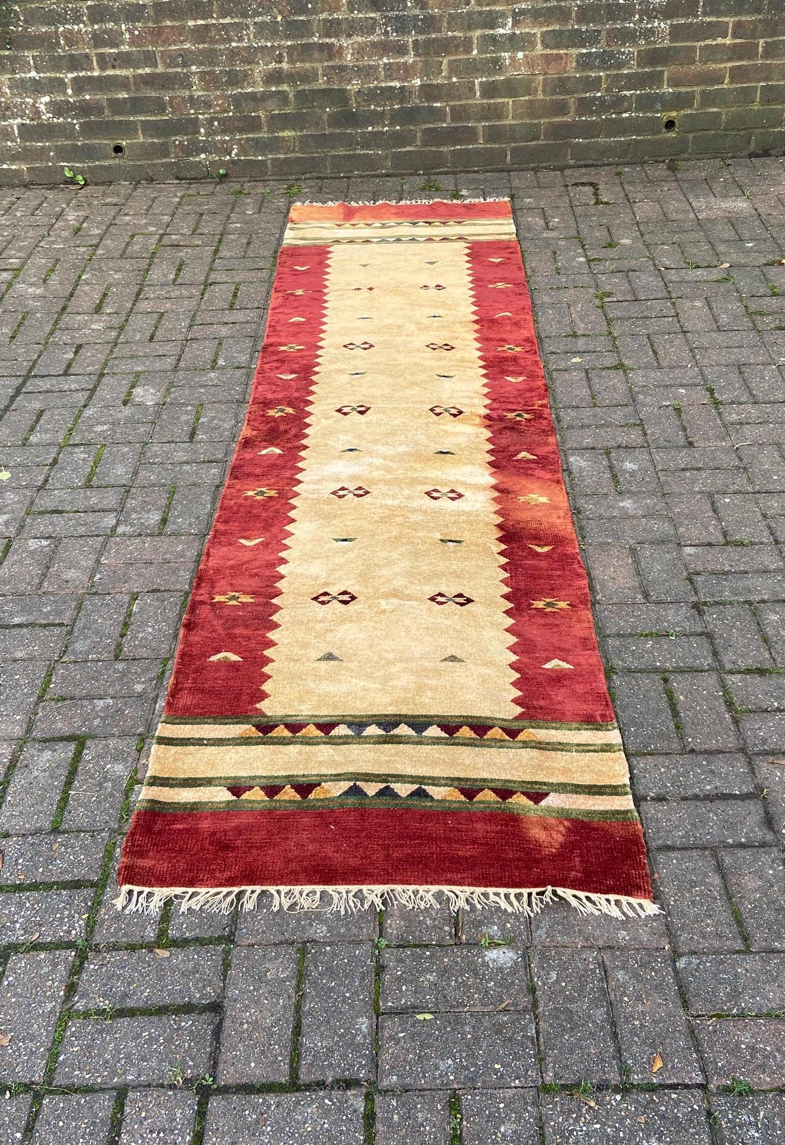 rug runner made out of chenille. autumnal columns and ethnic design.