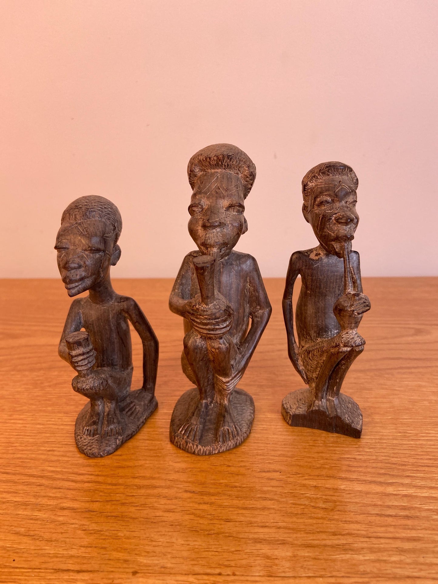 Three wonderful African carved wooden figurines, Traditional style Three Men carved out of wood