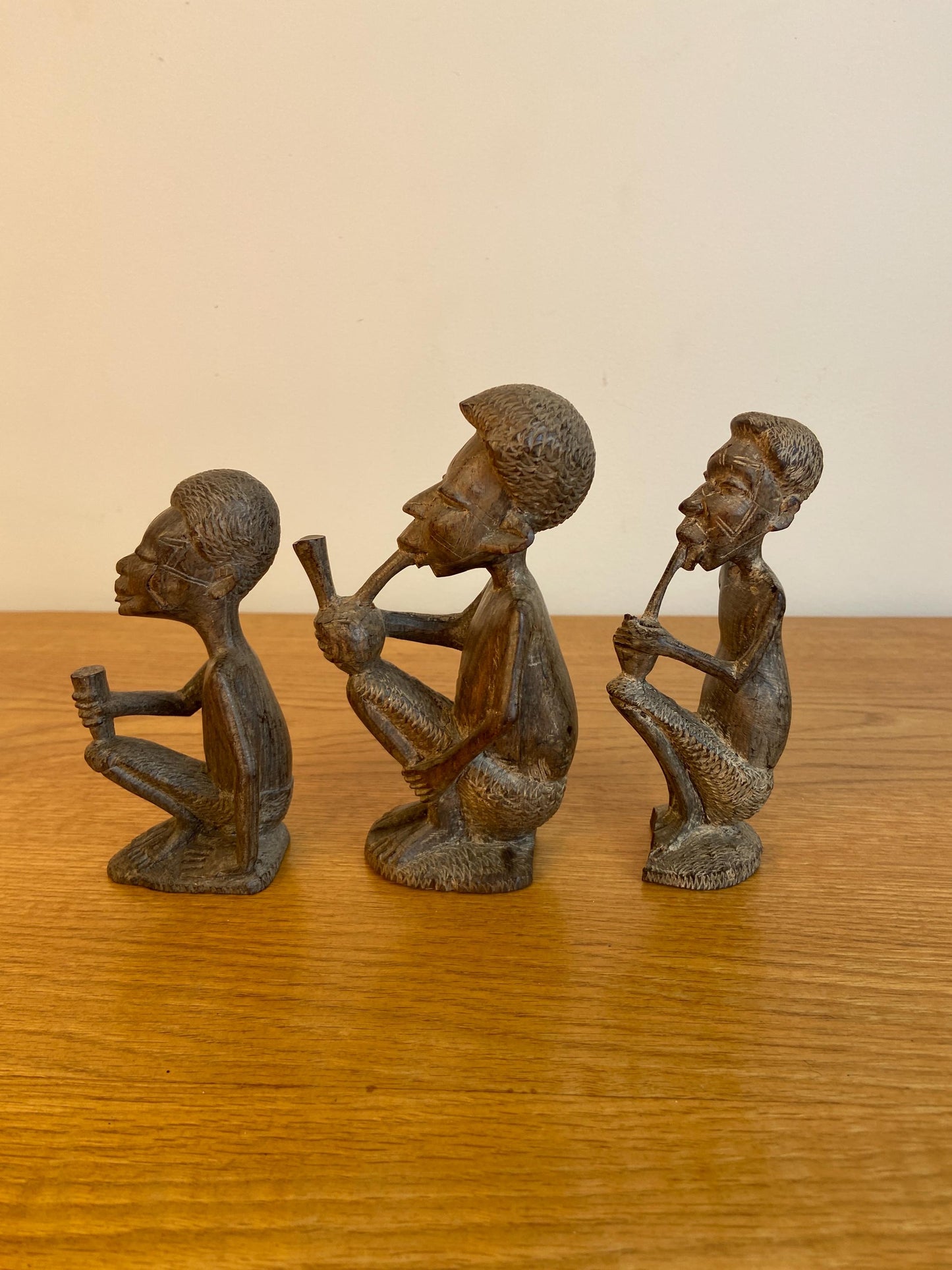 Three wonderful African carved wooden figurines, Traditional style Three Men carved out of wood