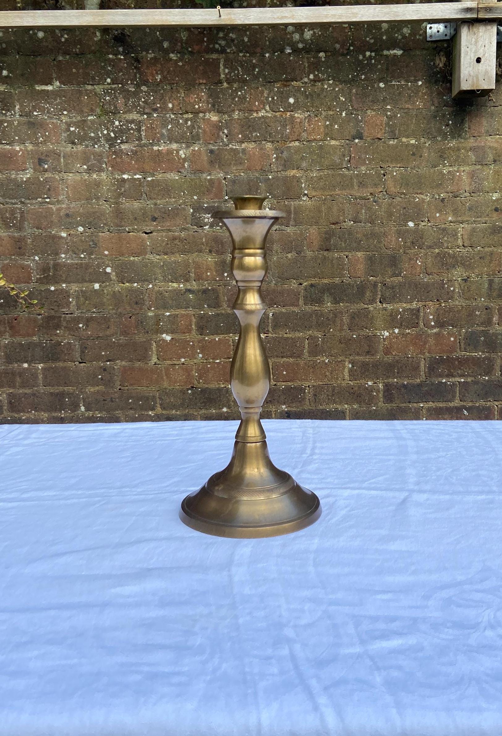 lovely tall candlestick holder made out of solid Indian brass.  excellent condition.  quality holder