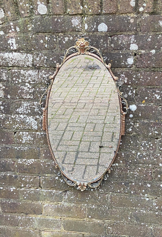 coloured painted moulded frame around this retro oval mirror. unusual retro mirror