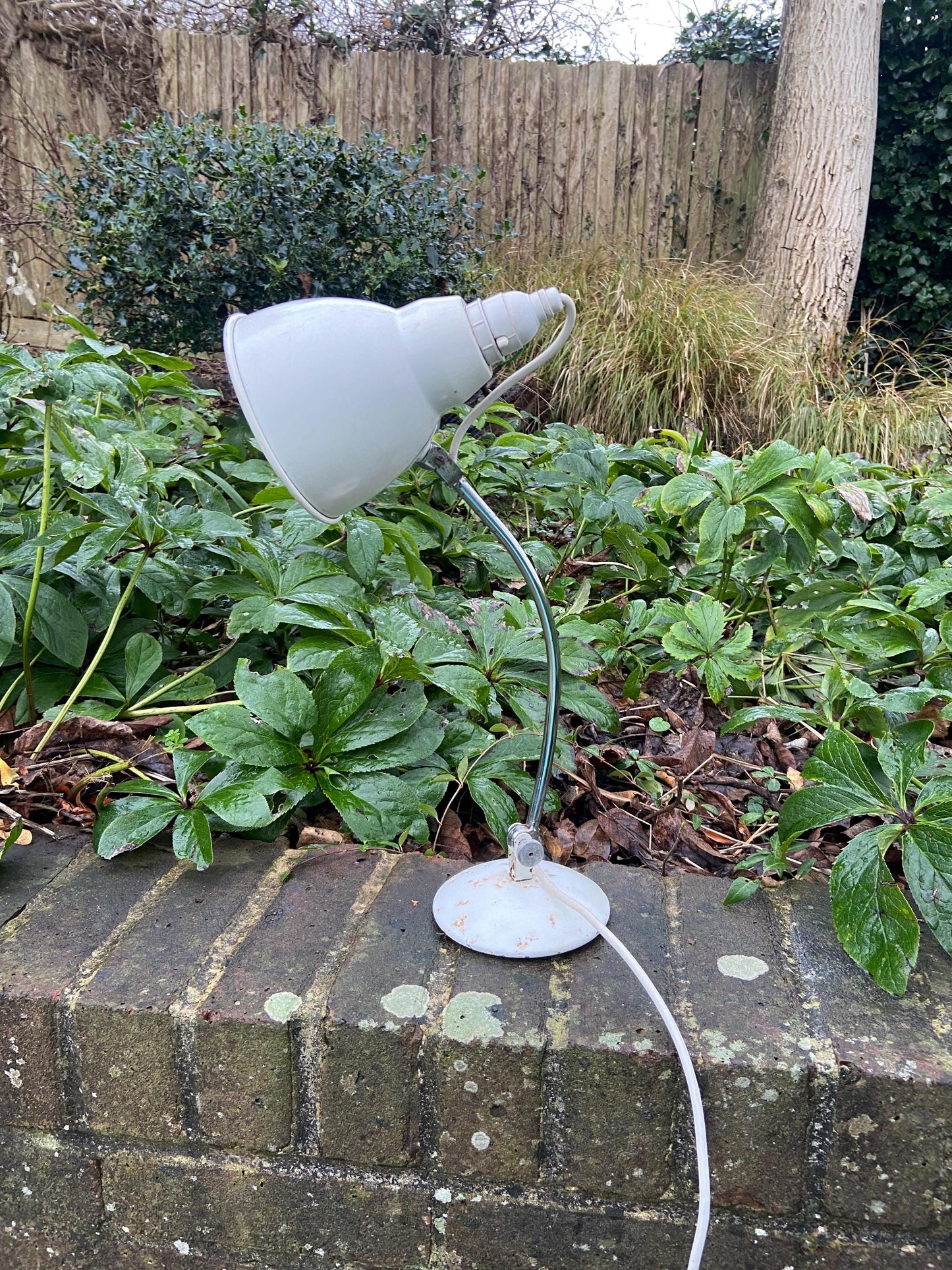 heavy metal mid century retro vintage desk lamp.  rusted finish now.  working.1950s desk lamp. adjustable study lamp.