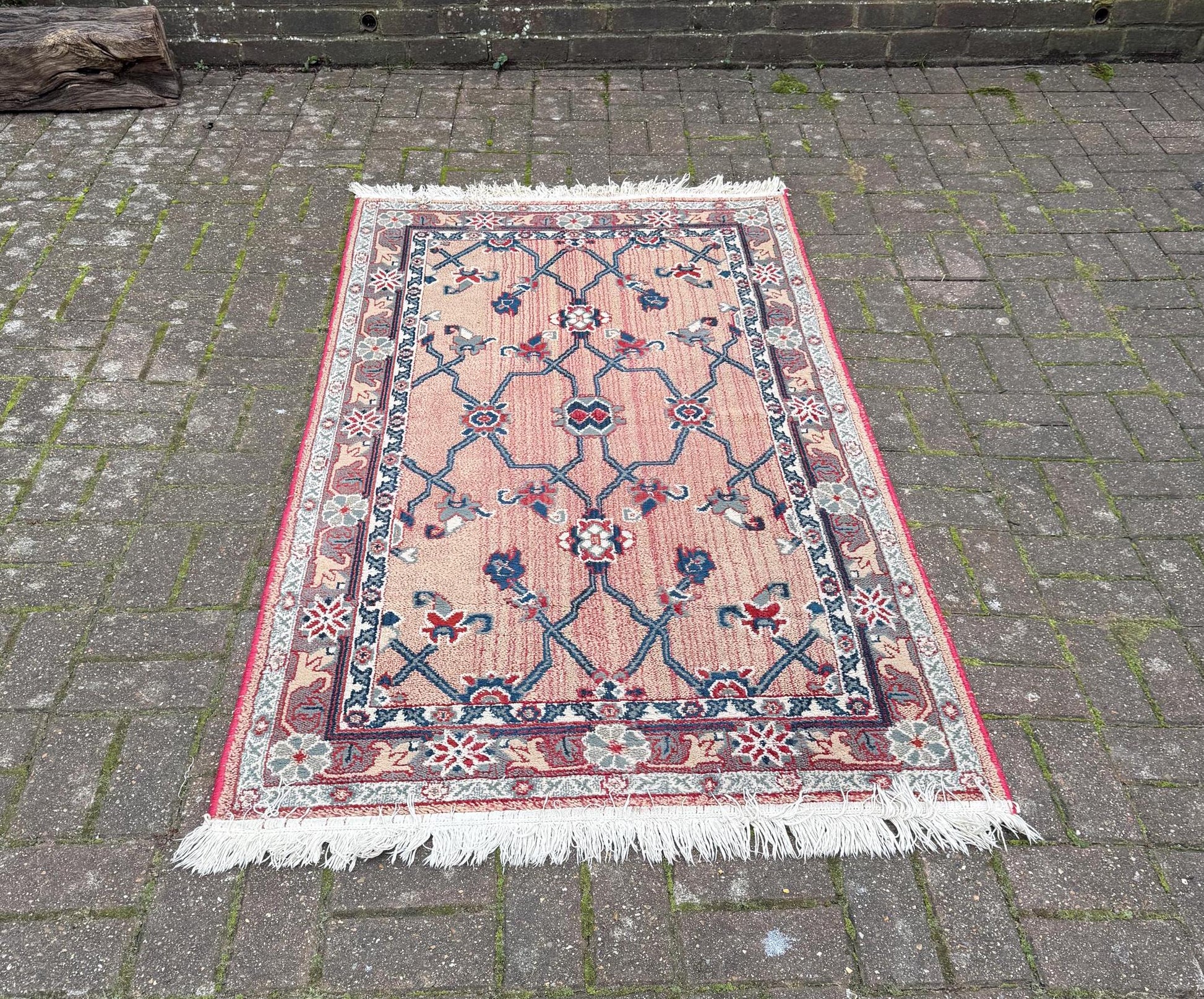 good medium sized rug in red,pink and blue. VGC. attractive vintage rug