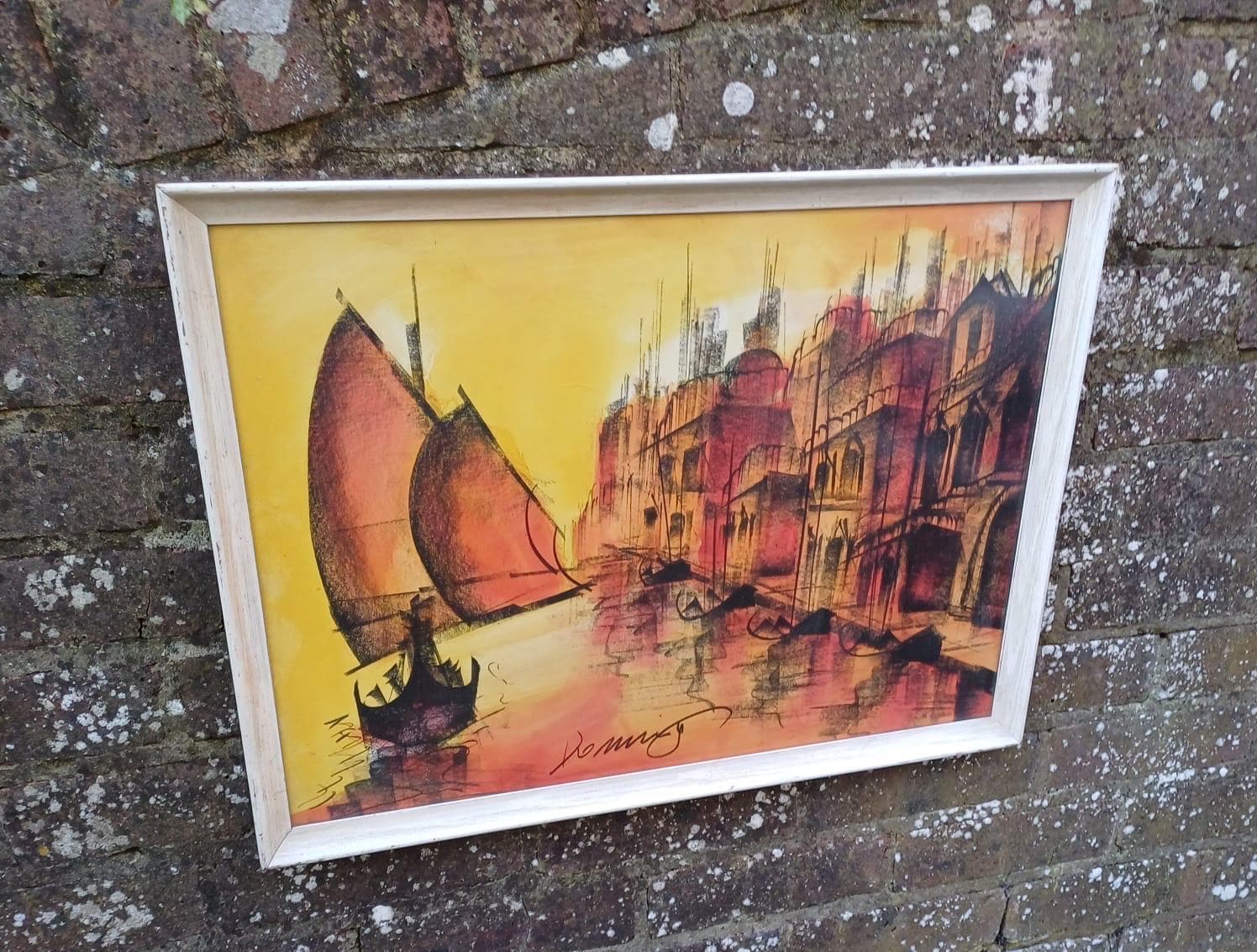 large retro print in oranges. likely sunset picture. signed. framed in white wooden frame. ready to hang