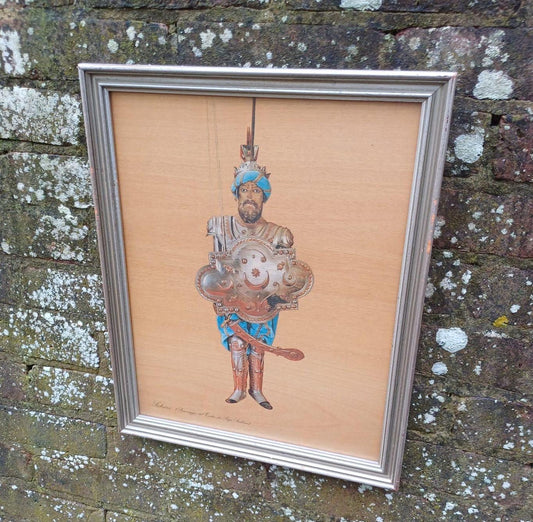A late 20th century print of a Sicilian Puppet, Sabrino, likely a puppet warrior from Teatro dei Pupi,the Sicilian Puppet Opera. In a glazed vintage frame.