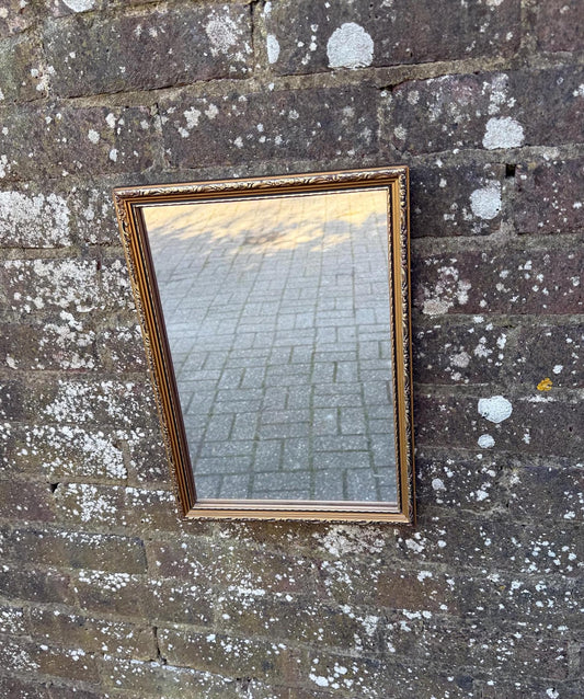 excellent small retro mirror. Vintage mirror. misted antique glass finish.  black and gold frame