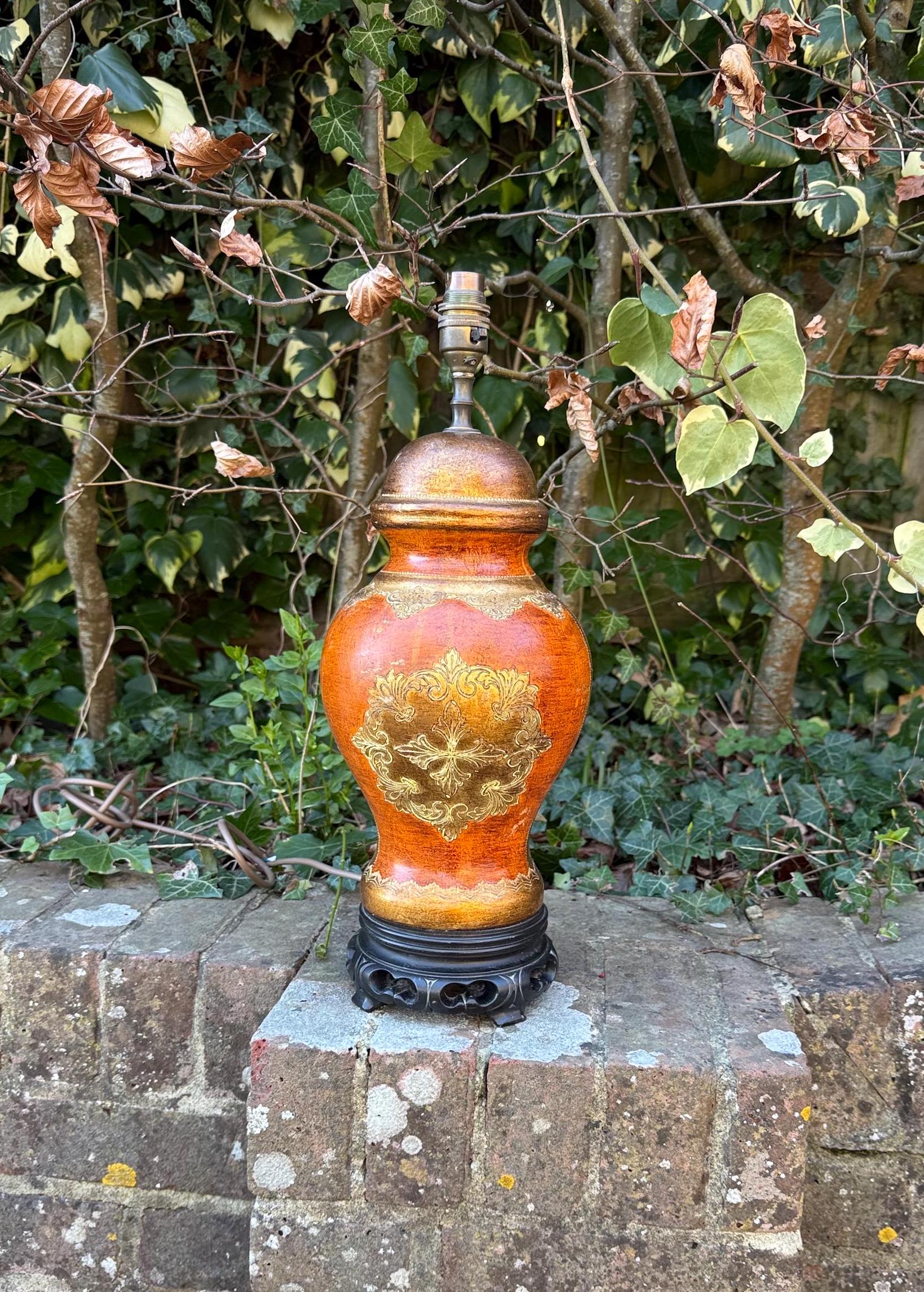 spanish influenced vintage table lamp in brunt orange, gold, black. working vintage table lamp
