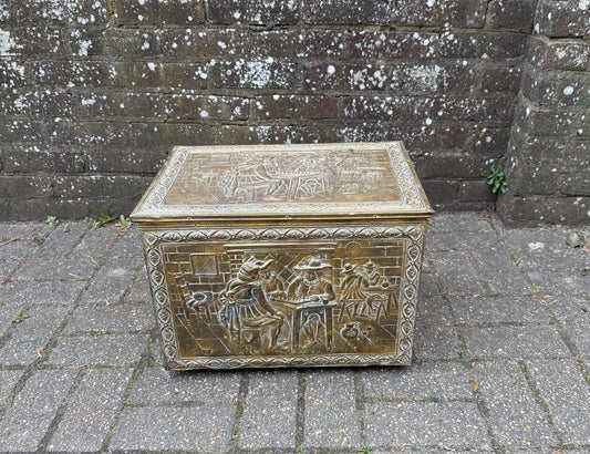 mid century coal box, wooden box covered in embossed and moulded beaten brass. medieval gothic style of coal box.