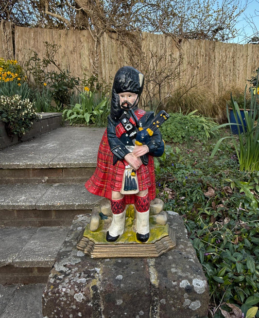 solid cast iron door stop, mid century. Highland Piper cast iron door stop.   Scottish Piper cast iron figure
