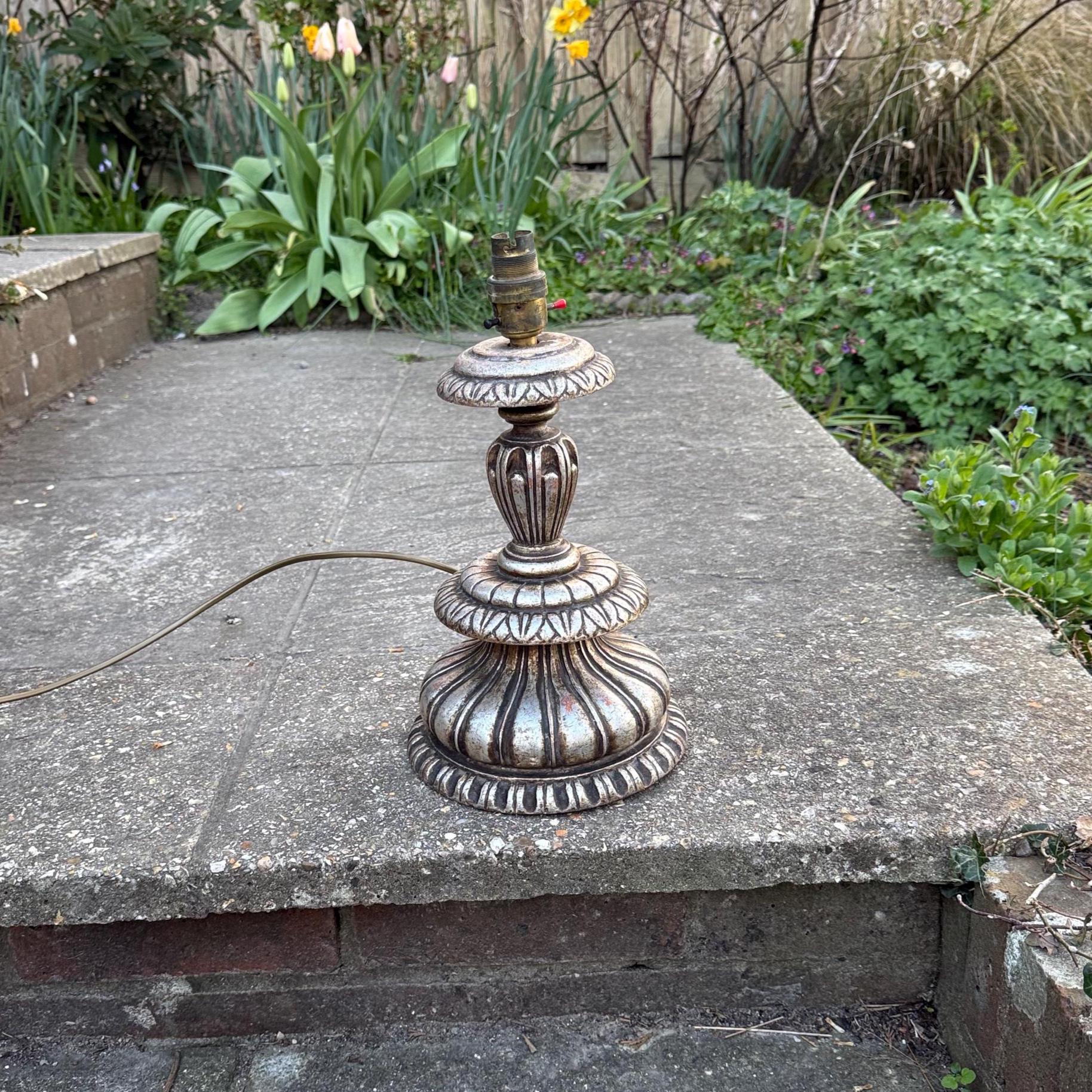 baroque style wooden carved vintage table lamp.  retro period. Vintage table lamp. painted silver table lamp
