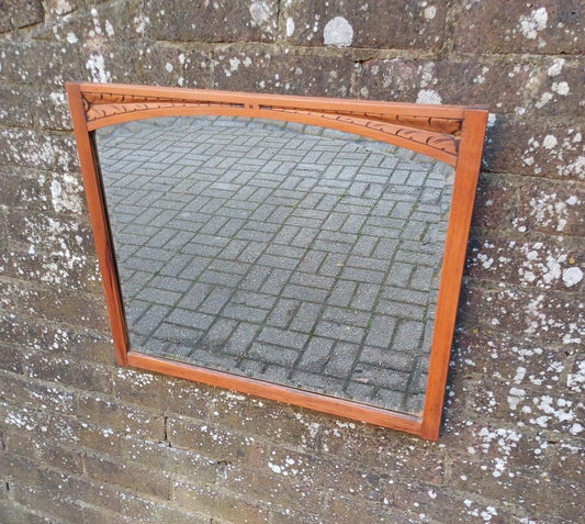 satin wood wall mirror. vintage wooden mirror. Some engraved detail on the top. over mantel wooden mirror.