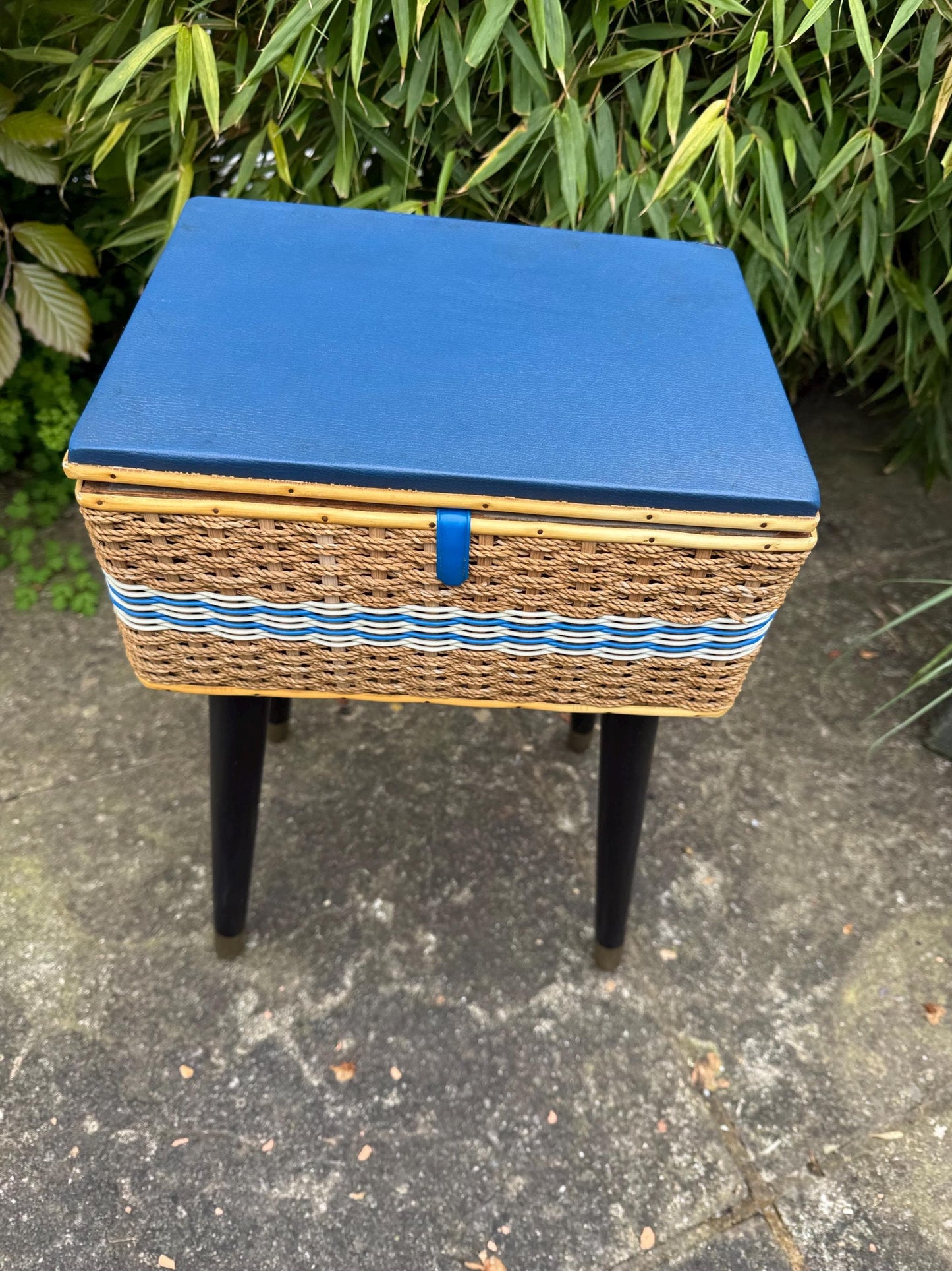 Vintage mid-century wicker sewing box on metal capped tapered legs, retro craft storage, with blue lid and metal tipped legs, 1950s workbox