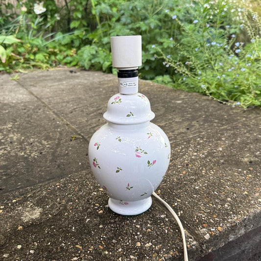 vintage china lamp. table lamp made out of white ceramic with painted pink roses and rose buds on it. made for St Michaels as shown on the underside felt base. Pretty working white ginger jar shaped lamp. Likely 1970s