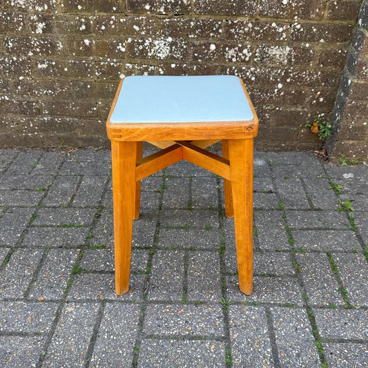 mid century beech stool with vinyl top. light golden wood with light grey blue seat. mid-century scandi influenced stool with tapered splayed legs