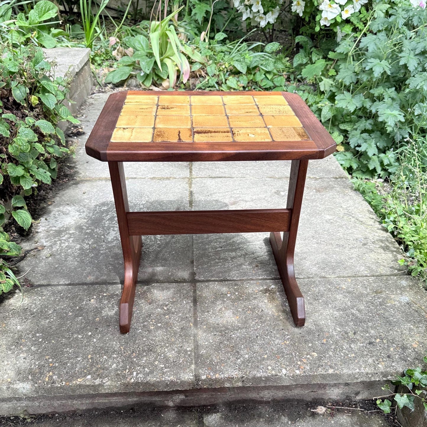 teak small table with tiled top. lovely small table with sled splayed legs and ochre yellow hand made tiles on the top