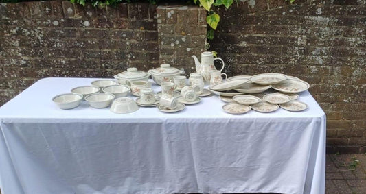 a dinner service by Royal Albert - the name of the service is Summer Fancy. Lovely large dinner service with floral and botanical pattern. Retro.