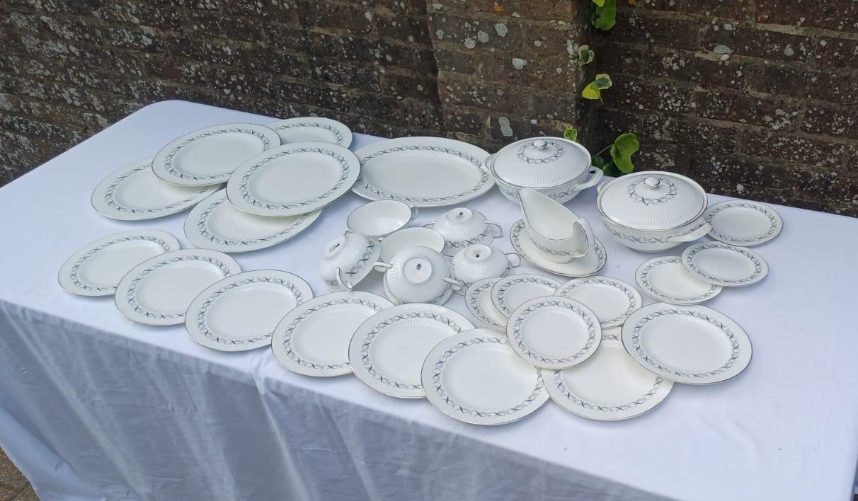 26 piece dinner service set. includes dinner plates, bowls, wide plates, etc. White porcelain with lovely silver and black detail. made by wedgwood.
