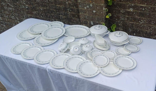 26 piece dinner service set. includes dinner plates, bowls, wide plates, etc. White porcelain with lovely silver and black detail. made by wedgwood.