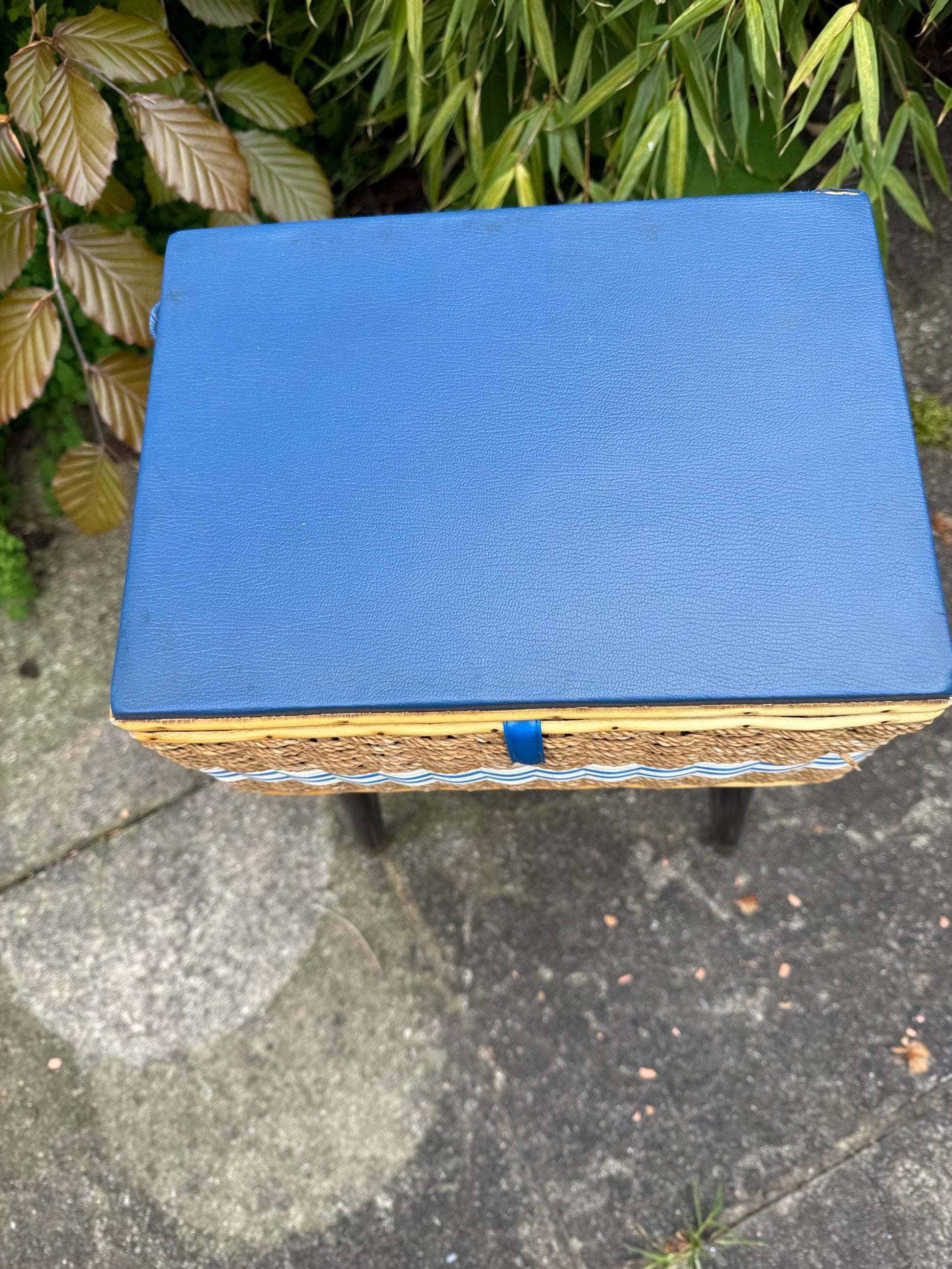 Vintage mid-century wicker sewing box on metal capped tapered legs, retro craft storage, with blue lid and metal tipped legs, 1950s workbox