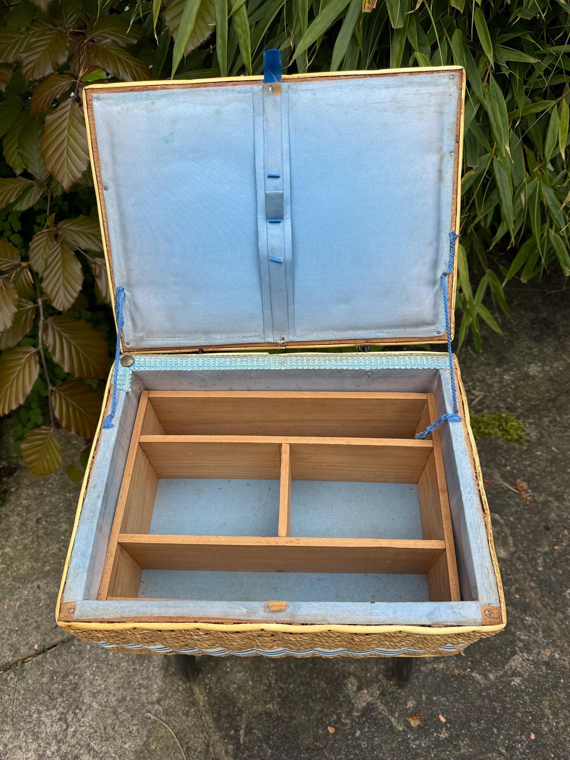 Vintage mid-century wicker sewing box on metal capped tapered legs, retro craft storage, with blue lid and metal tipped legs, 1950s workbox