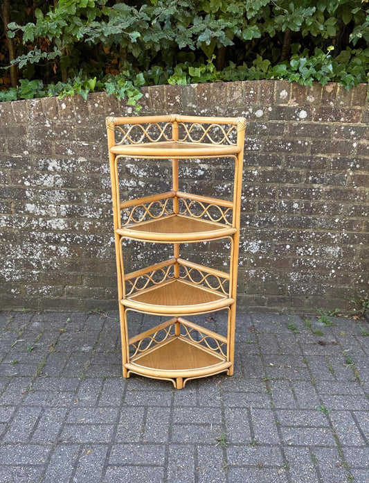 retro cane and wicker corner shelf with four shelves. excellent condition. golden colour