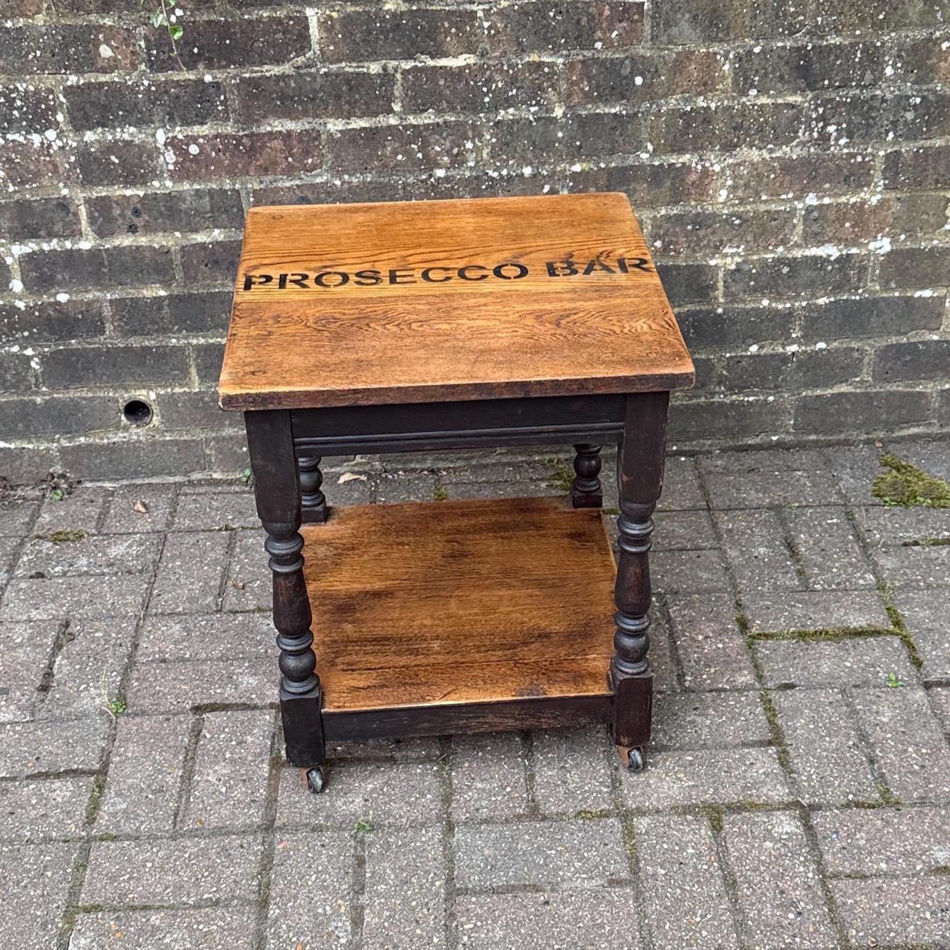 upcycled vintage oak small trolley table. perfect small table with oiled top and shelf. two tone wood. solid oak. heavy table.  refurbed oak table