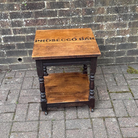 upcycled vintage oak small trolley table. perfect small table with oiled top and shelf. two tone wood. solid oak. heavy table.  refurbed oak table