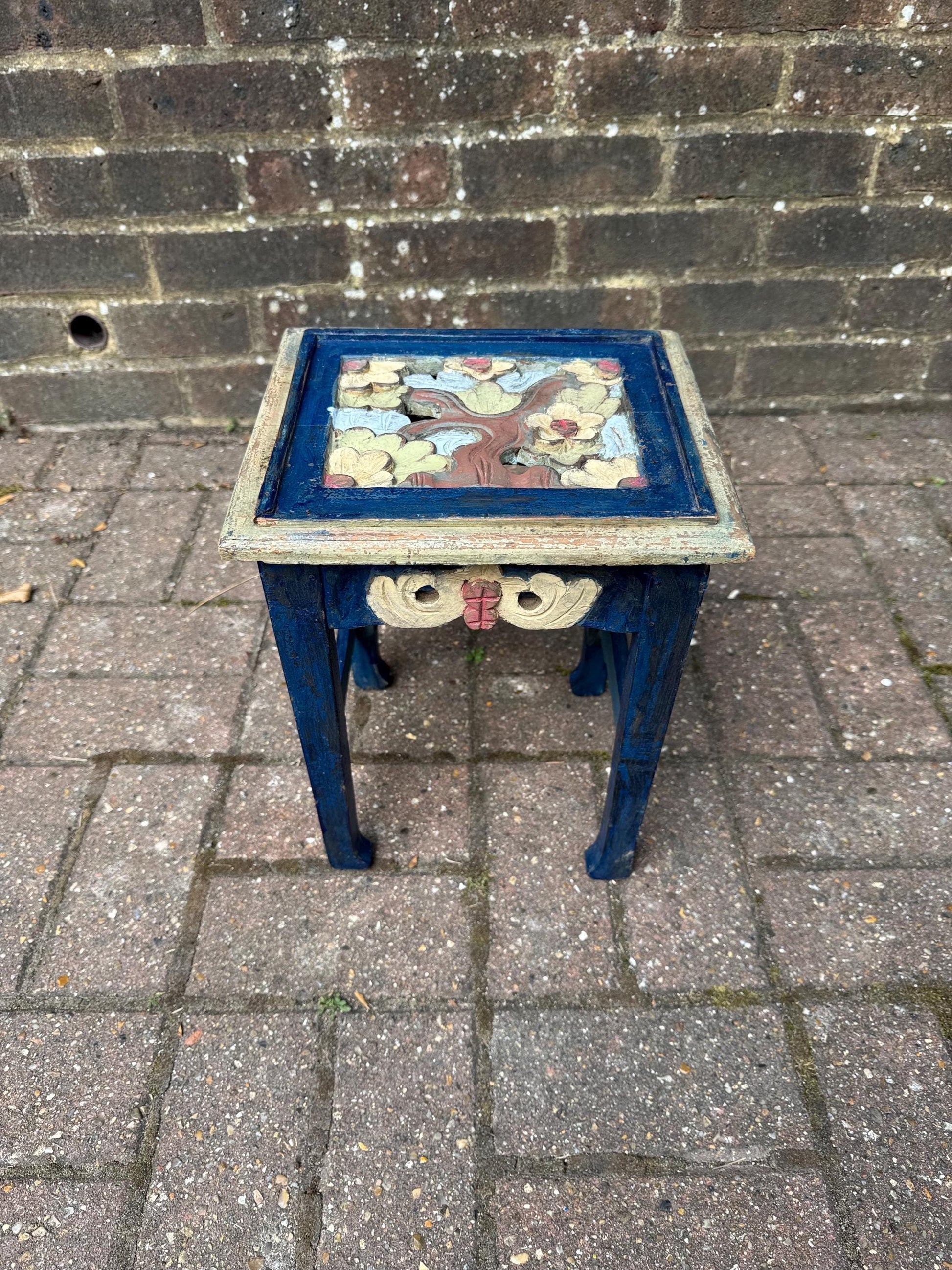 boho chic, hand painted and carved small wooden table in bold and beautiful colours. cobalt blue shabby chic finish on the frame. pastel colours on the top woodland detail. side carvings which look like owl faces, but are not.  rustic and unusual, possibly european.