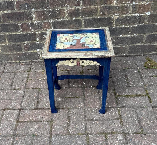 boho chic, hand painted and carved small wooden table in bold and beautiful colours. cobalt blue shabby chic finish on the frame. pastel colours on the top woodland detail. side carvings which look like owl faces, but are not.  rustic and unusual, possibly european.