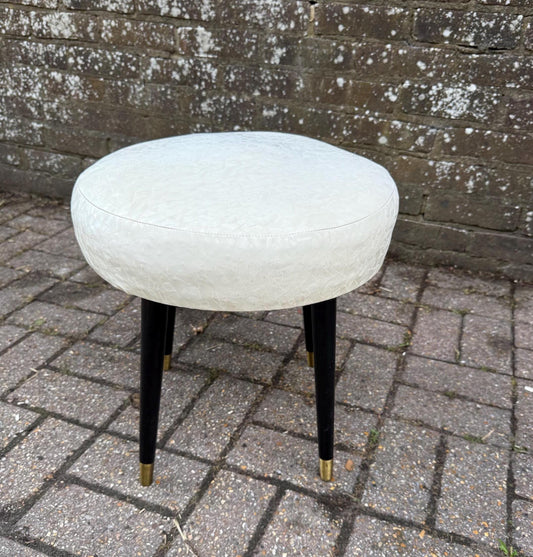 1960s stool with black tapered legs and metal toe caps. White vinyk plastic covered seat. vgc