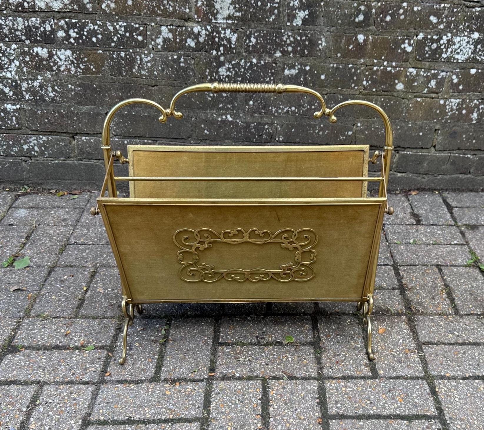 folding metal and velvet mid century rack. lovely magazine rack with gorgeous detail including a folding mechanism for easy storage and movement