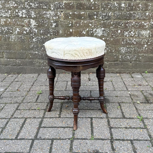 victorian antique swivel adjustable round stool with mahogany frame. lovely buttoned cream cushion and dark mahogany carved and turned base. excellent quality stool
