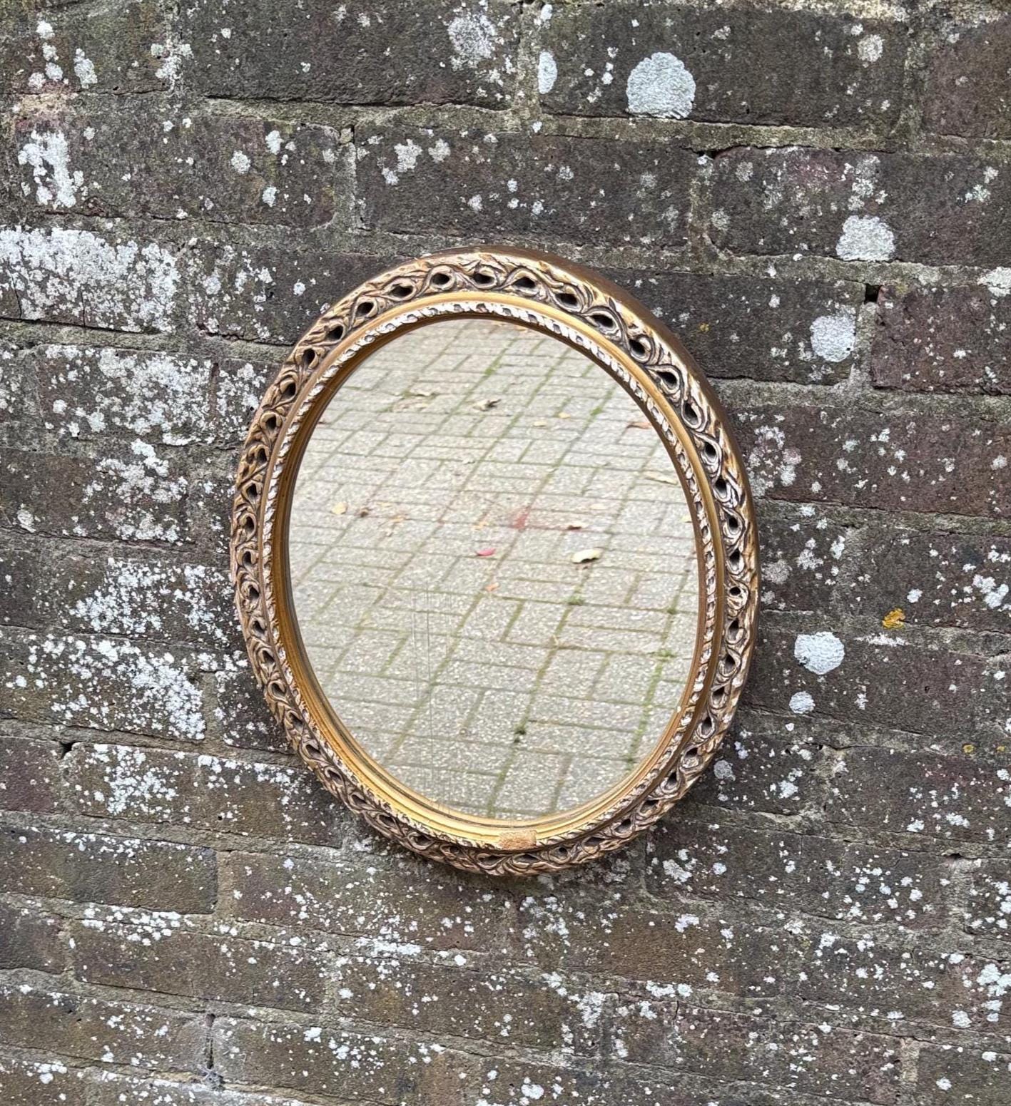 vintage round gilt mirror. ornate gilt retro mirror. plaster gold mirror. oval regency style mirror. hollywood gold mirror