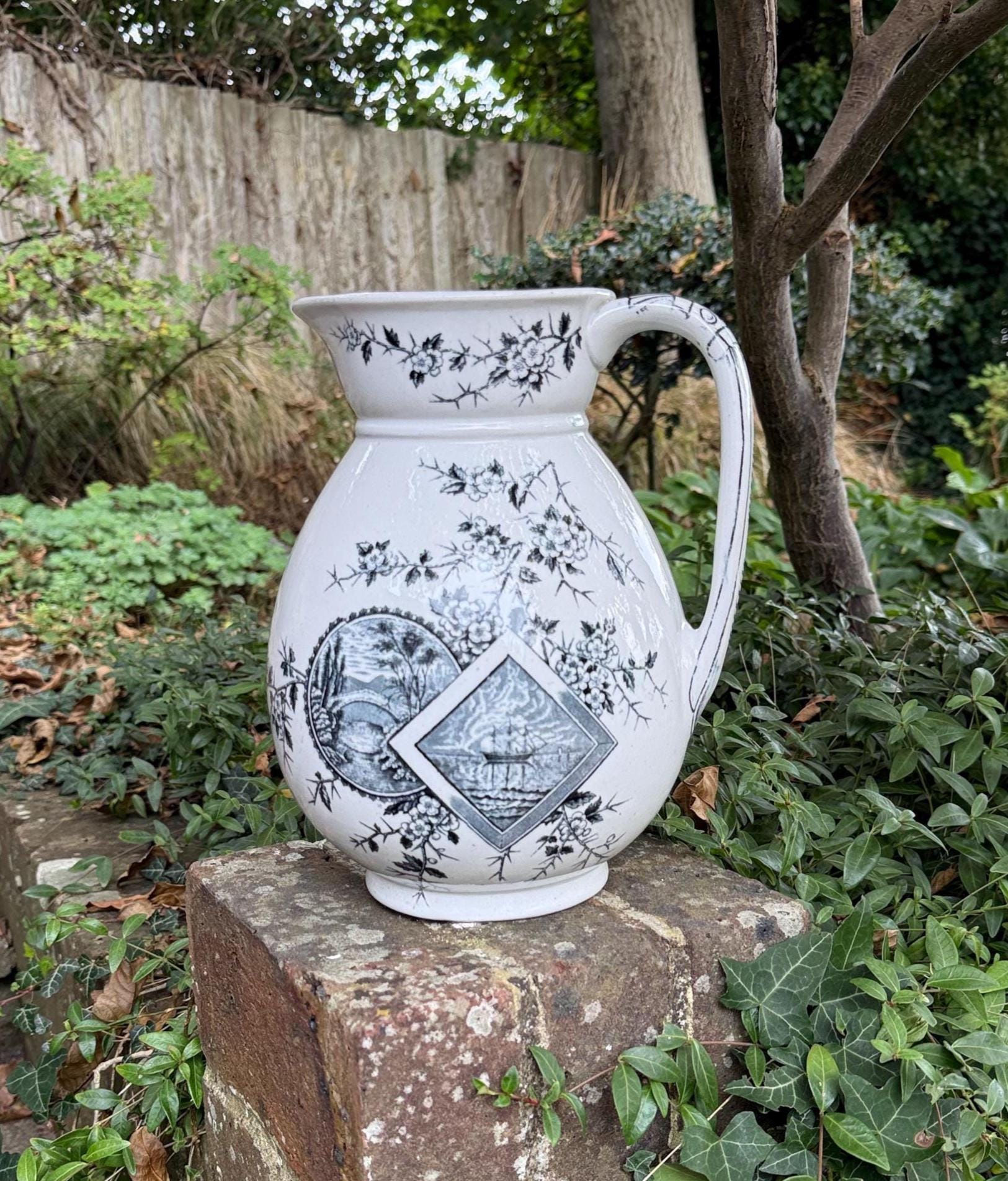 Victorian jug or vase. Blak grey transfer print of sailing ship and a country scene. labelled Baltimore.  VGC. white heavy pottery with the transfer prints