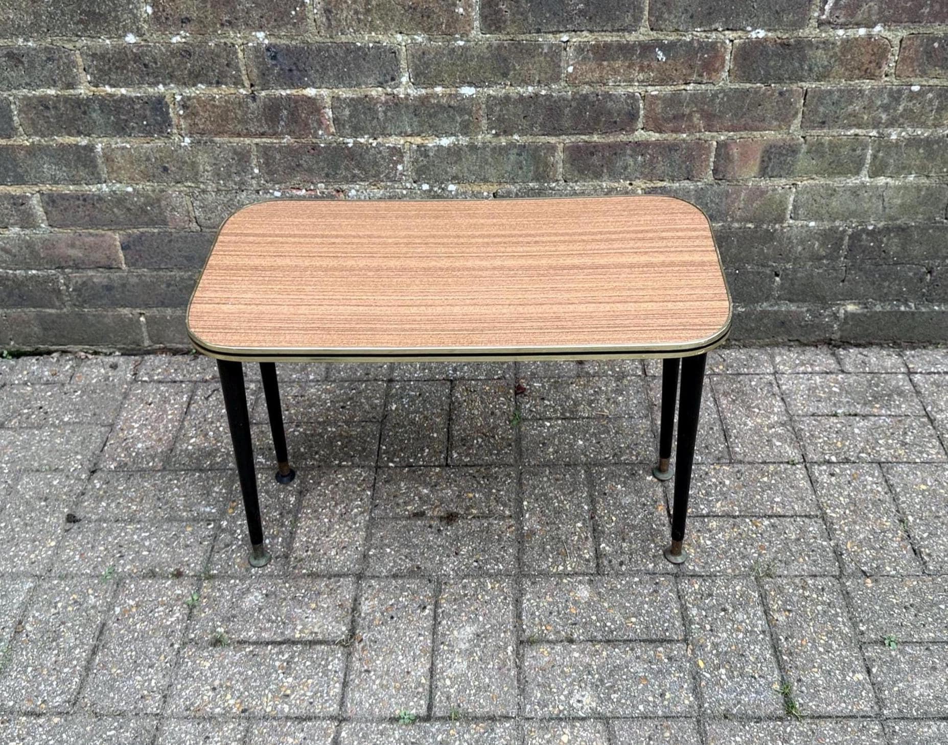 mid century formica topped table with black atomic legs, metal cap legs. tapered wooden legs on small table