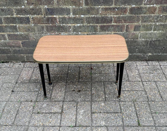 mid century formica topped table with black atomic legs, metal cap legs. tapered wooden legs on small table