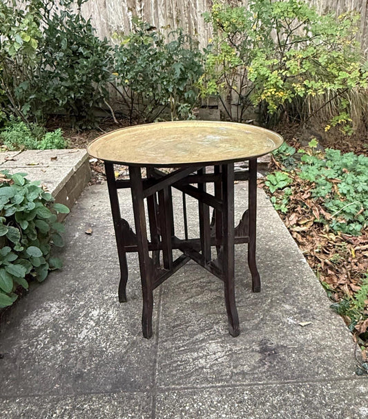gorgeous brass topped table with moorish turkish design frame. dark wood intricate frame with brass engraved tray top