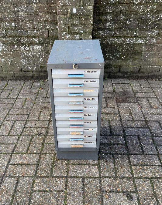 industrial metal storage unit. original grey and cream filing drawers. perfect for use as any storage.