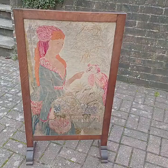 Large Vintage Solid Oak Arts and Crafts Fire Screen Tapestry Lady Feeding Parrot. One Metre Tall