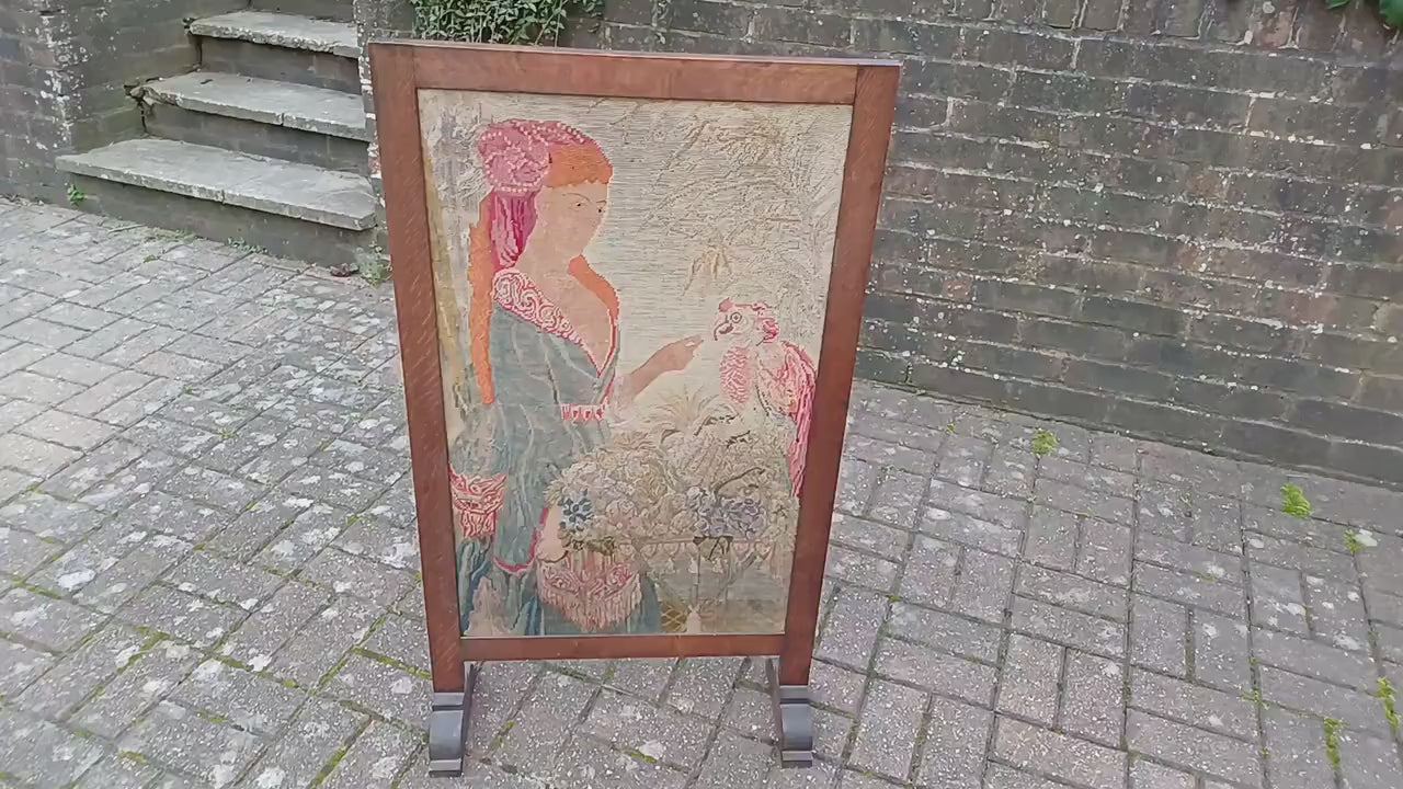 Large Vintage Solid Oak Arts and Crafts Fire Screen Tapestry Lady Feeding Parrot. One Metre Tall